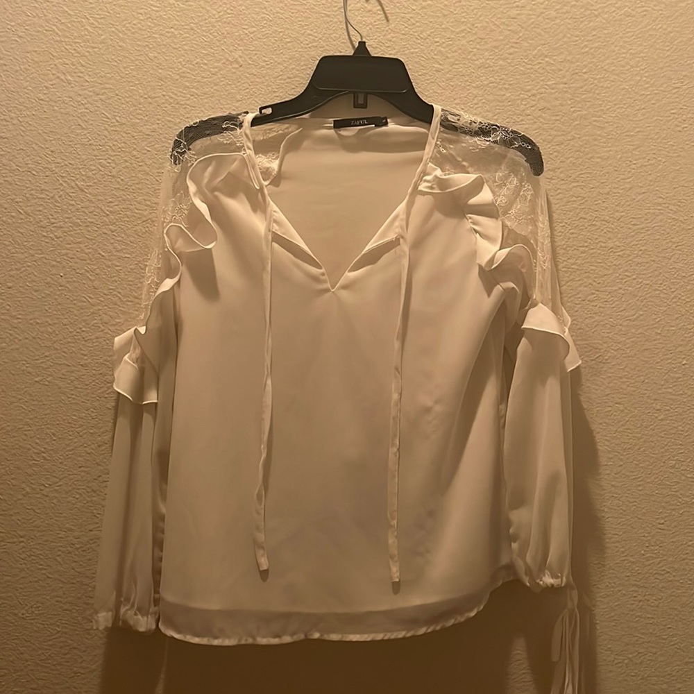 White blouse with ruffle sleeves